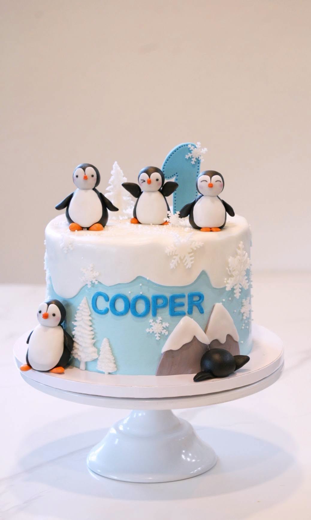 Penguin first birthday cake